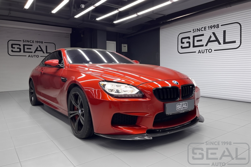 Автомобиль BMW 6-Series после перетяжки фальшпанелей сидений в автоателье SealAuto